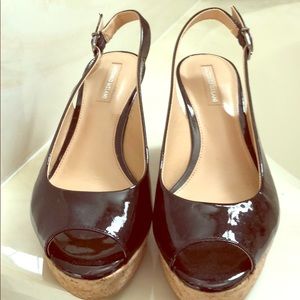 Antonio Melani black patent leather cork wedge.